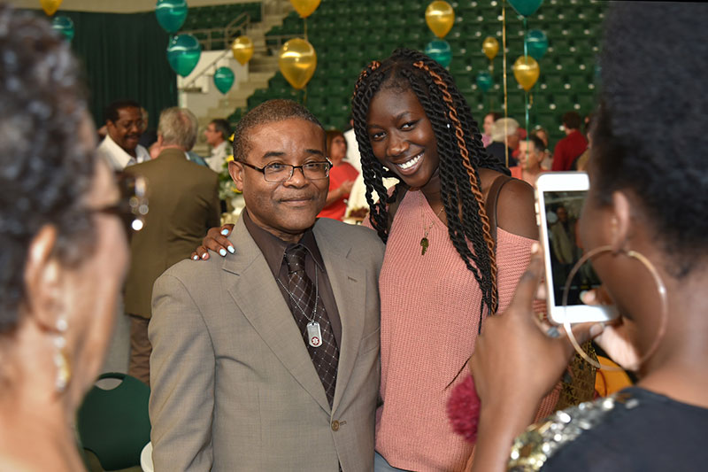 Howard Gordon shares a photo with a student