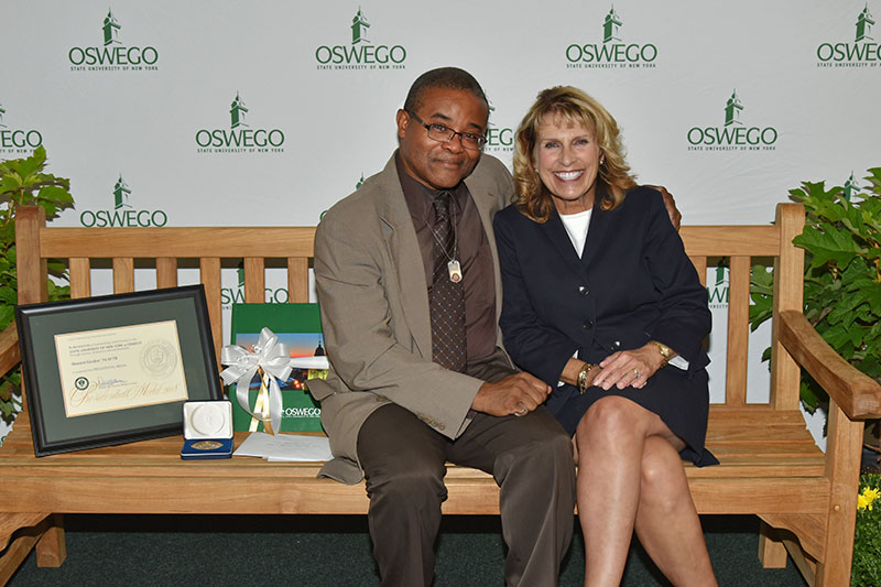 Howard Gordon and President Stanley on bench dedicated to Howard's longtime service