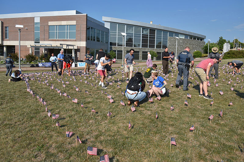 Planting American flags to remember those lost on 9/11