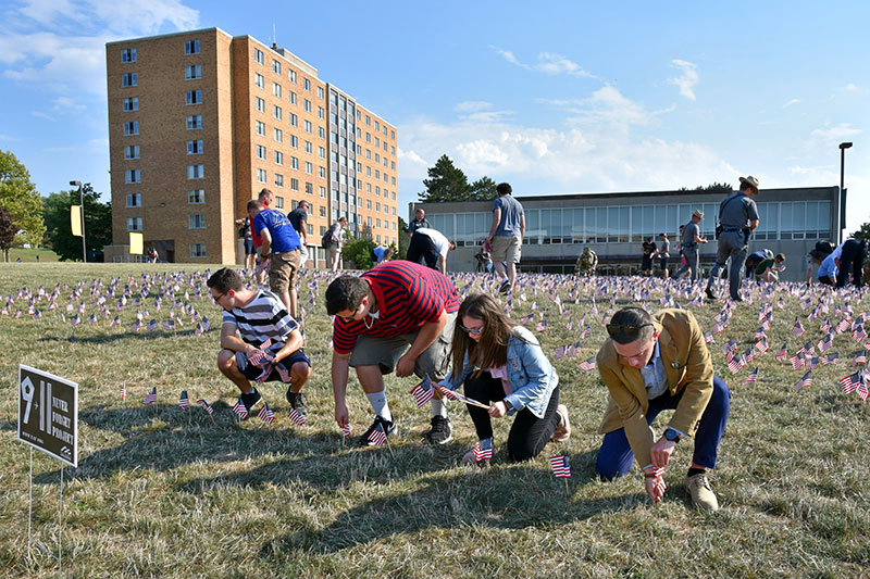 Planting American flags to remember those lost on 9/11