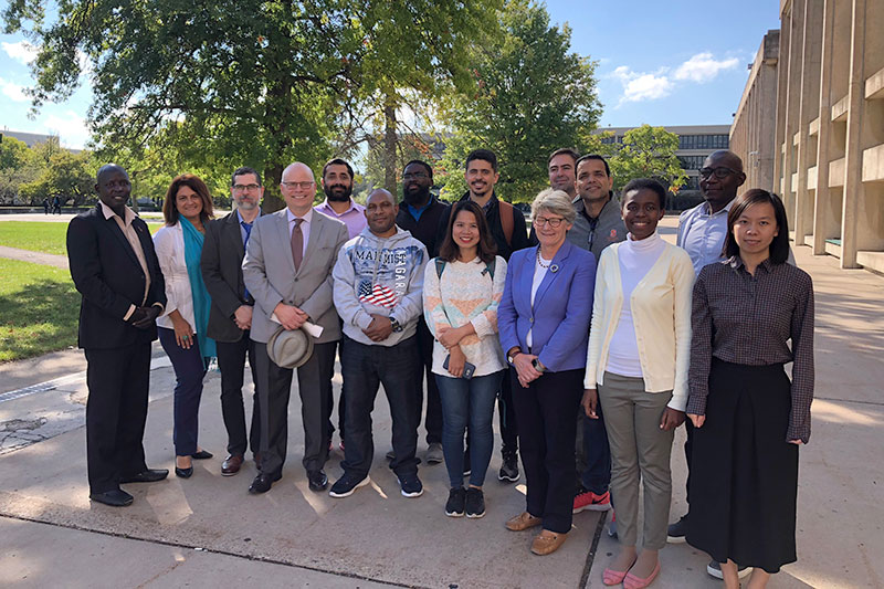 Humphrey Fellows gather outside library