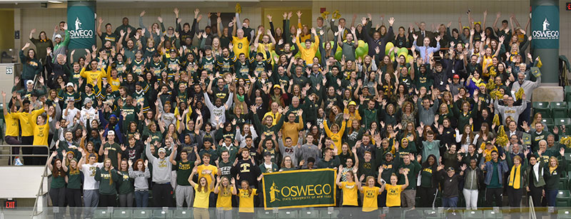 Gathering of the Oswego family in green and gold