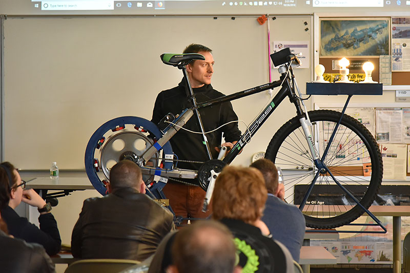 Presenter Michael Uchal shows his bicycle generator