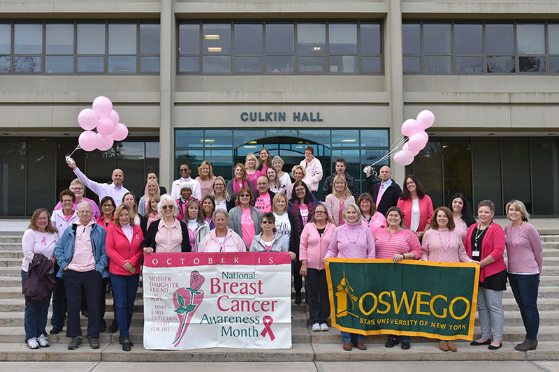 Employees dress in pink to raise awareness, funds to combat breast cancer