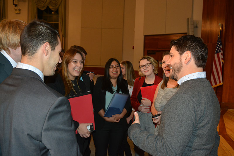 Students gather around 2005 SUNY Oswego alumnus Matt Romano, NBC Universal’s senior director for emerging platforms, SYFY and USA