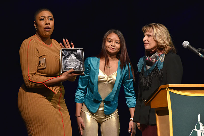 College presents Symone Sanders plaque of appreciation for MLK keynote