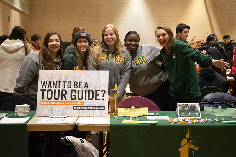 Tour guides staff table at involvement fair