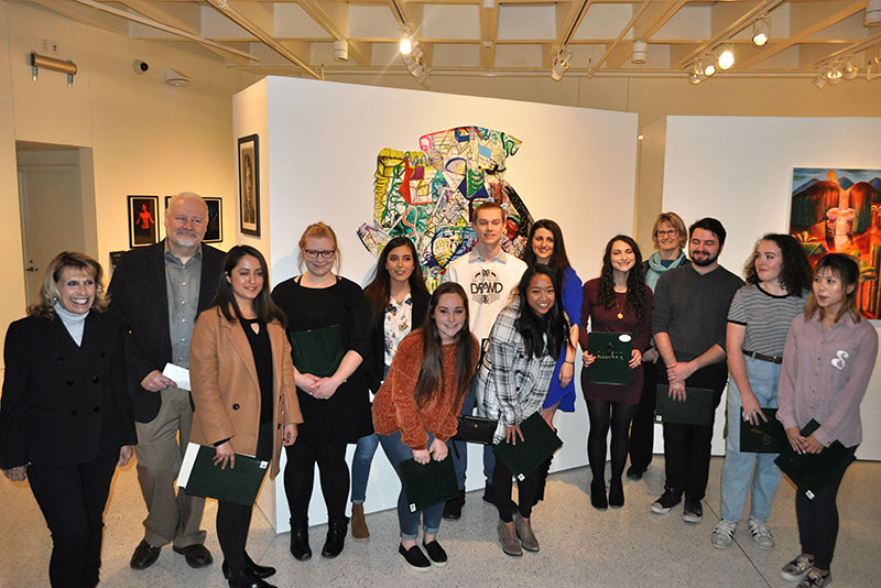 Students with work in juried art exhibition