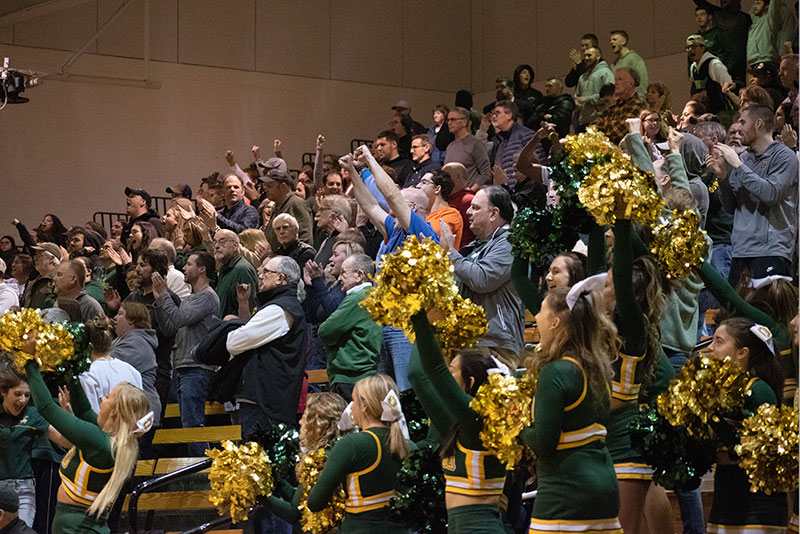 Fans and cheerleaders show their appreciation for the resilient Lakers men’s basketball team during an NCAA win