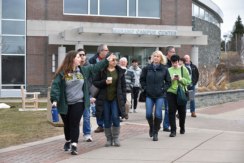 Admissions intern Cassie Carudo leads a tour