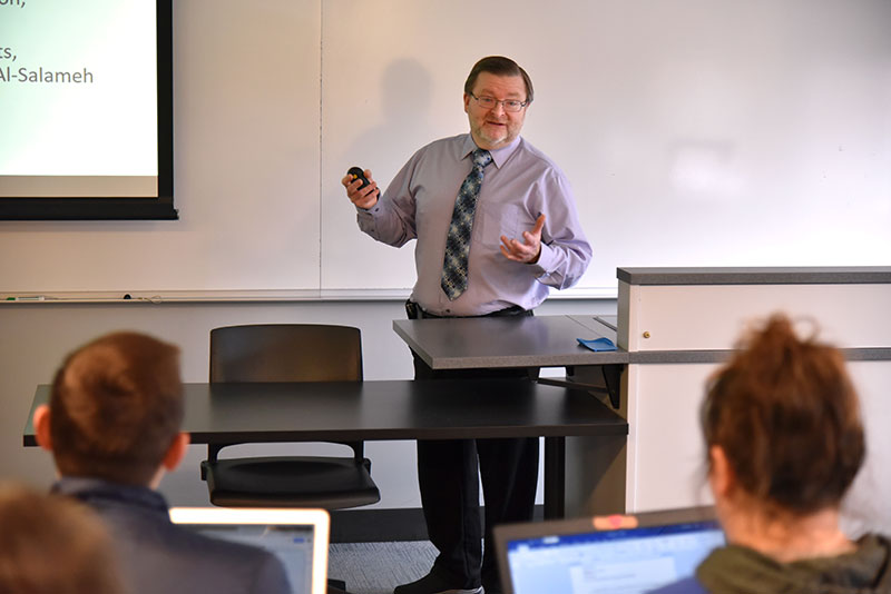 Edward Hale, an assistant administrative lab director at Oswego Health, makes a presentation