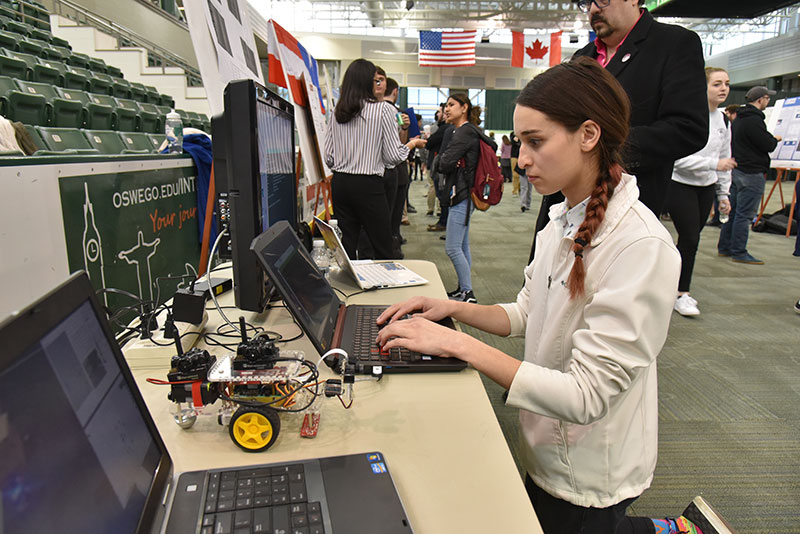 Tonia Sanzo workers on her Quest project during the Poster Session