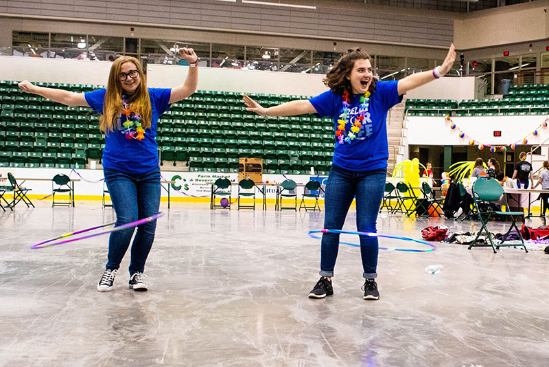 Juniors Kaitlyn Barney and Nora Walsh try their hooping skills at the Relay for Life