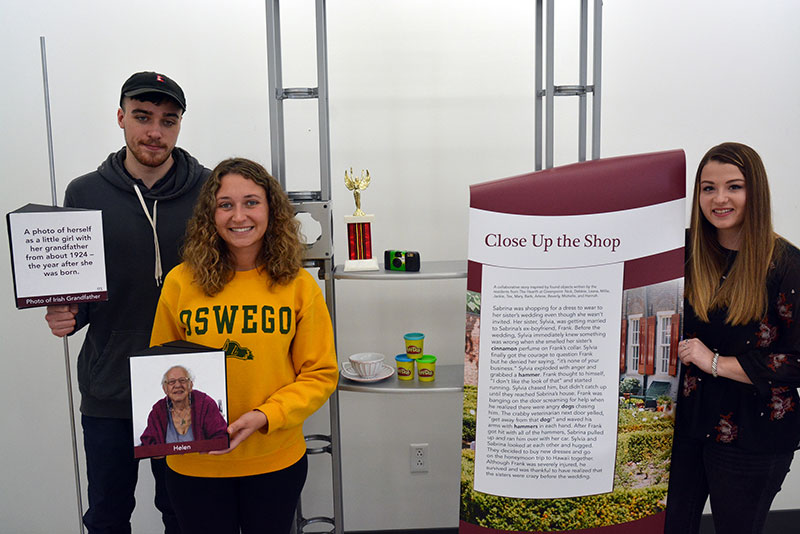 Students Miles Petersen, Hannah Sojka and Julie Farquhar hold graphic arts work in connection with the "Recollections" traveling exhibition