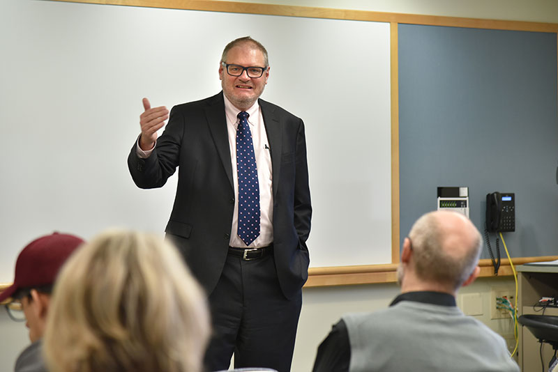 Thomas Mahl, an alumnus and chief of gastroenterology at the Veterans Administration in Buffalo, talks with students