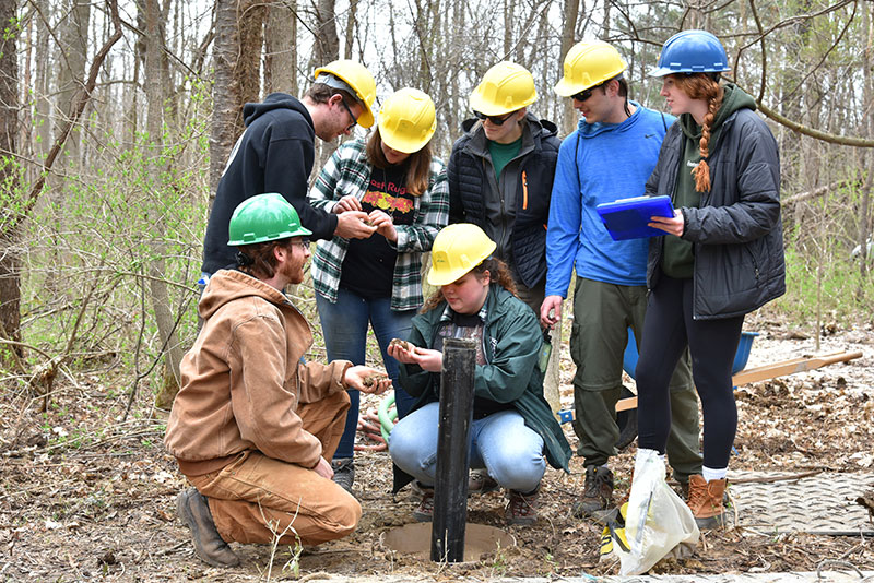 Justin Stroup's hydrogeology class inspects material from the drilling of new groundwater monitoring wells