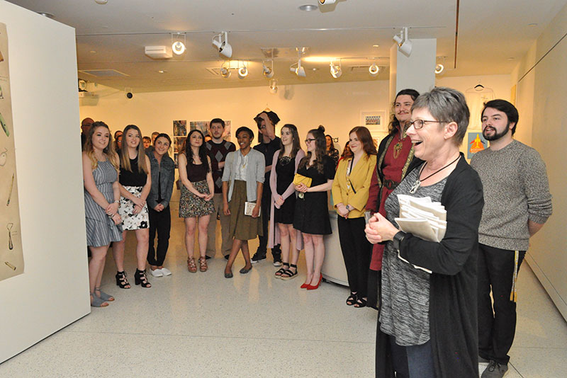 Student artists gather April 26 in Tyler Art Gallery at the opening reception for the BFA I, joining art faculty member Cara Thompson