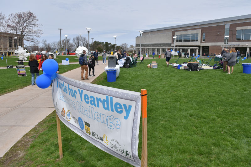 SUNY Oswego students, faculty and staff, as well as community members, walk to remember and to prevent domestic and dating violence during Yards for Yeardley