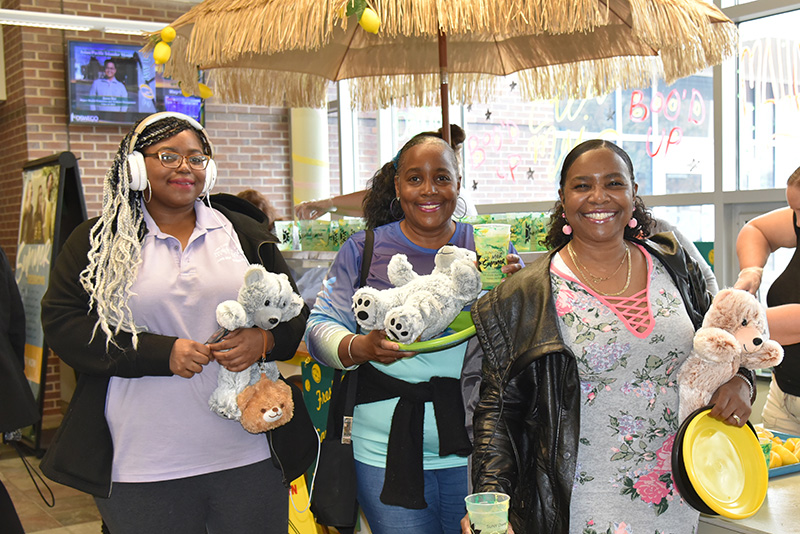 Yarbrielle Ingram (left), a May graduate with a master’s degree in graphic design, enjoys OzFest on May 10 with her mother (center) and aunt (right) 