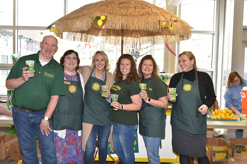 Extended Learning staff offers fresh-made lemonade to all passersby at their annual OzFest stand