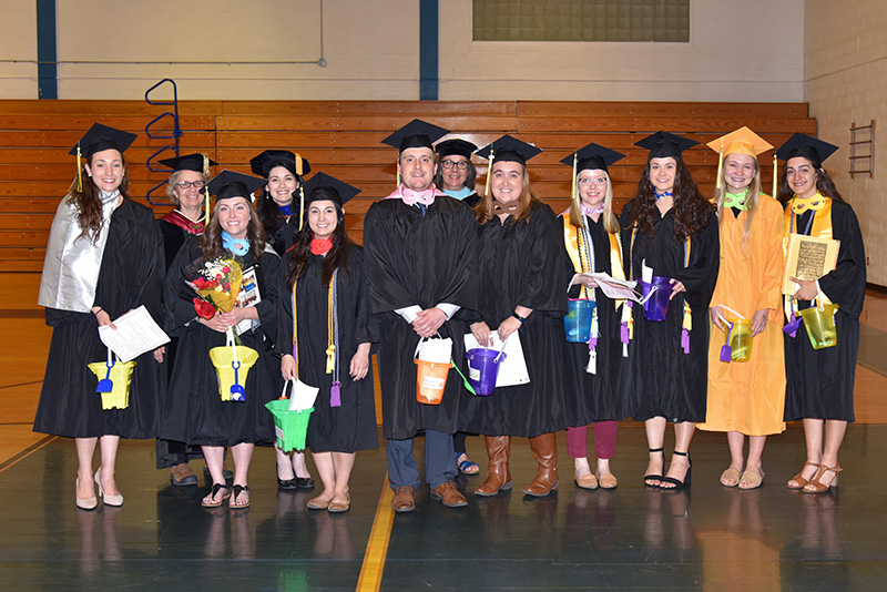 Graduating student teachers and SUNY Oswego School of Education faculty members gather May 17 following a ceremony