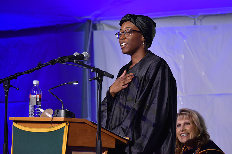 Tenaja Smith-Butler speaks during Torchlight Ceremony