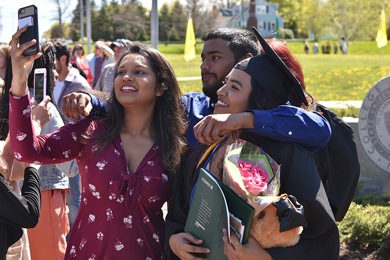 Many a joyous selfie with family and friends commemorated the sunny Commencement day