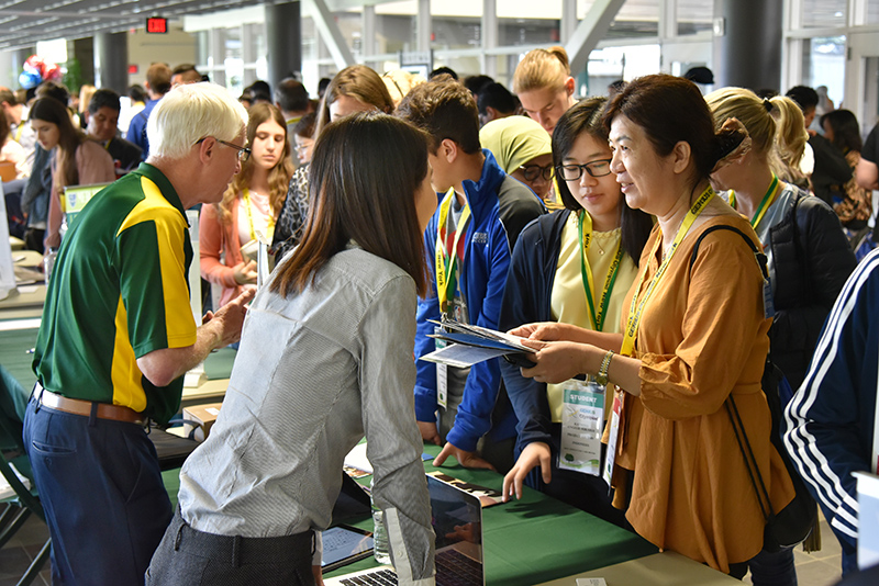 Students learn more about SUNY Oswego during the GENIUS Olympiad College Fair