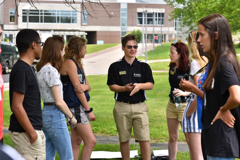 Laker Leaders lead a small Orientation group in the quad in front of Penfield Library