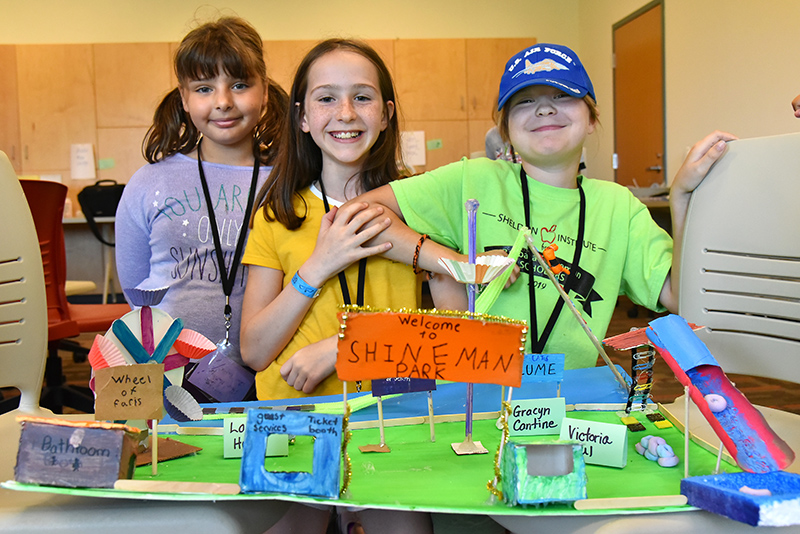 Students show off Shineman Park amusement park model