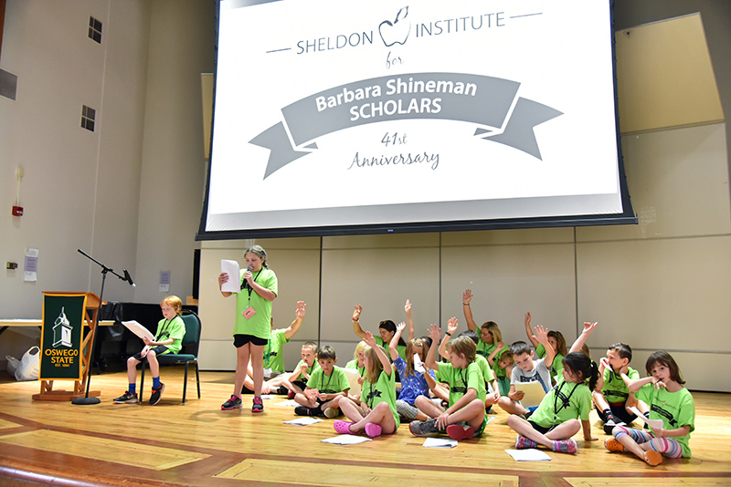 Youngest students at Sheldon Institute put on a skit about learning about community