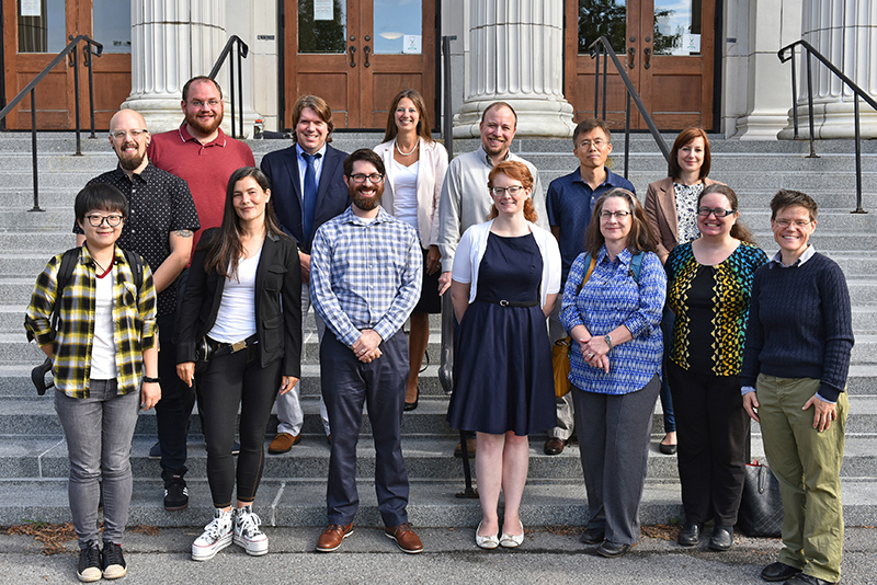 New faculty pose on the steps of Sheldon Hall