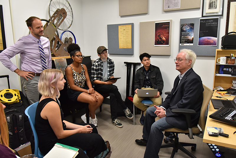 1973 graduate Tim Cooper (seated right), an acclaimed composer and music producer, visited campus to meet with students