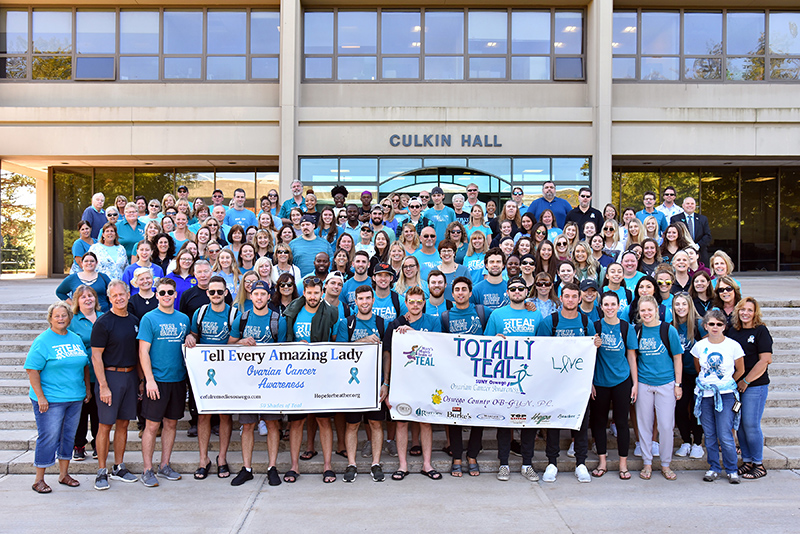 Campus community members gathered in teal