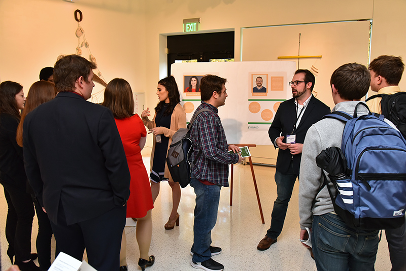 Alumni Marissa Sarbak and Matt Bishop speak with current students at Career Connectors networking event