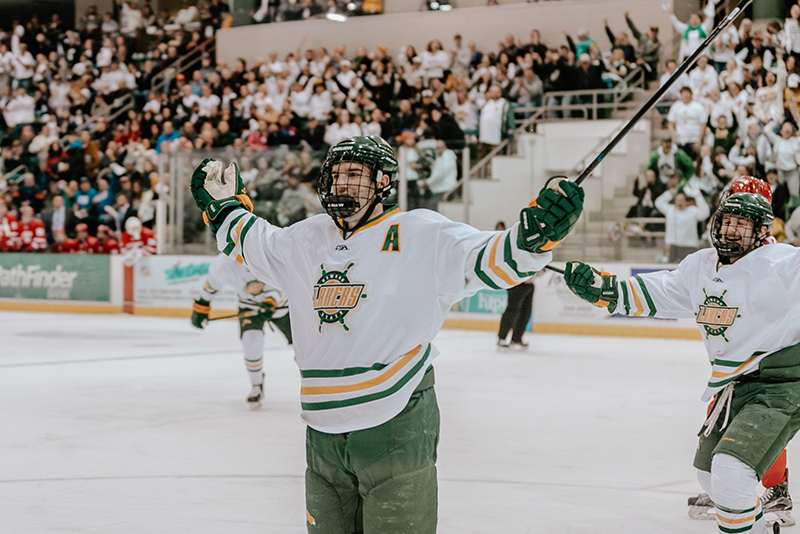 Junior defenseman Carter Allen of the Oswego men’s hockey team celebrates his first-period goa