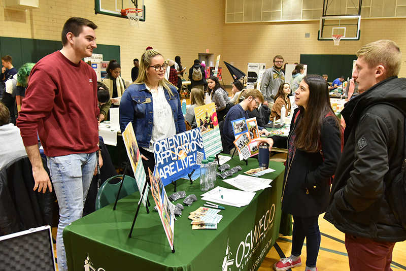 Laker Leaders Benn Delisle and Olivia Harrington, at left, provide information about New Student Orientation during the Spring Student Involvement Fair