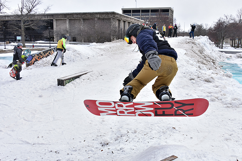 The annual Rail Jam, hosted by the Oswego Ski and Snowboard Club, had a fresh supply of lake-effect snow for its friendly competition on Feb. 28 on the academic quad. Here snowboarder Chris Hallock catches some air.