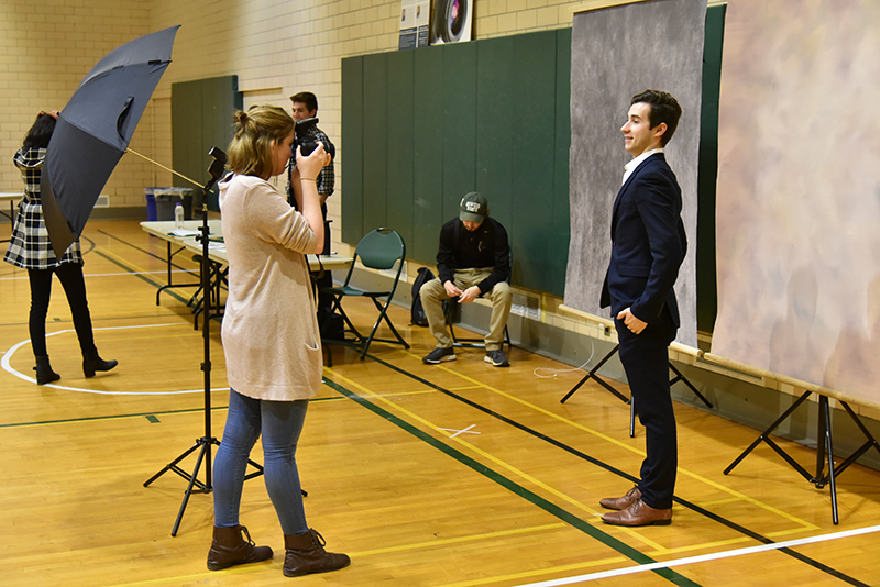 David Hite, a senior dual major in broadcasting and mass communication and in philosophy, gets a professional-looking photo taken at the March 4 Career and Internship Fair photobooth