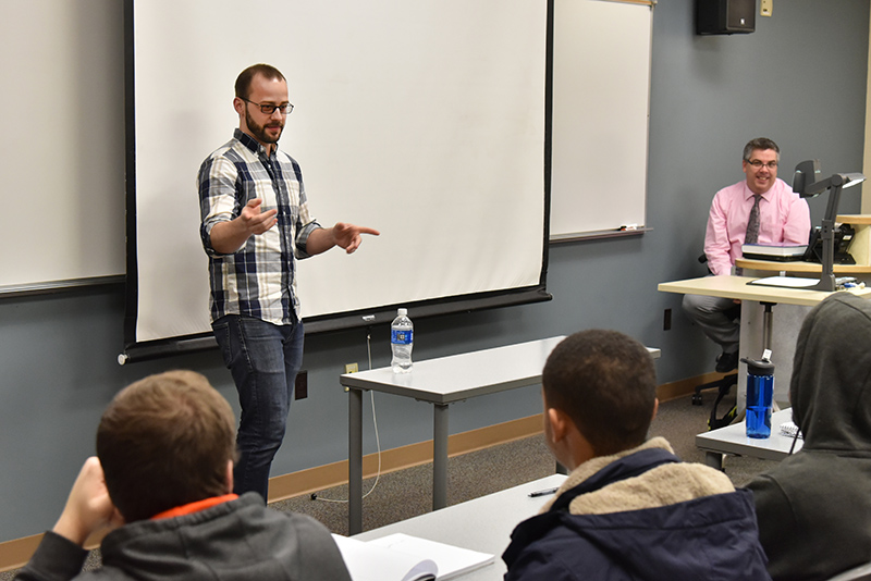 David Greco, a 2013 SUNY Oswego alumnus and operations manager for Saratoga Performing Arts Center/LiveNation, speaks March 9 to the “Operations Management” class