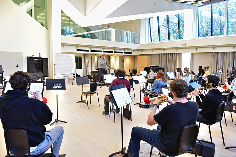 The college’s Wind Ensemble conducts a class and rehearsal under the direction of music faculty member and chair Trevor Jorgensen. The new normal for the group includes special masks and windscreens, as well as breaks to clear out Room 11 in Tyler Hall.