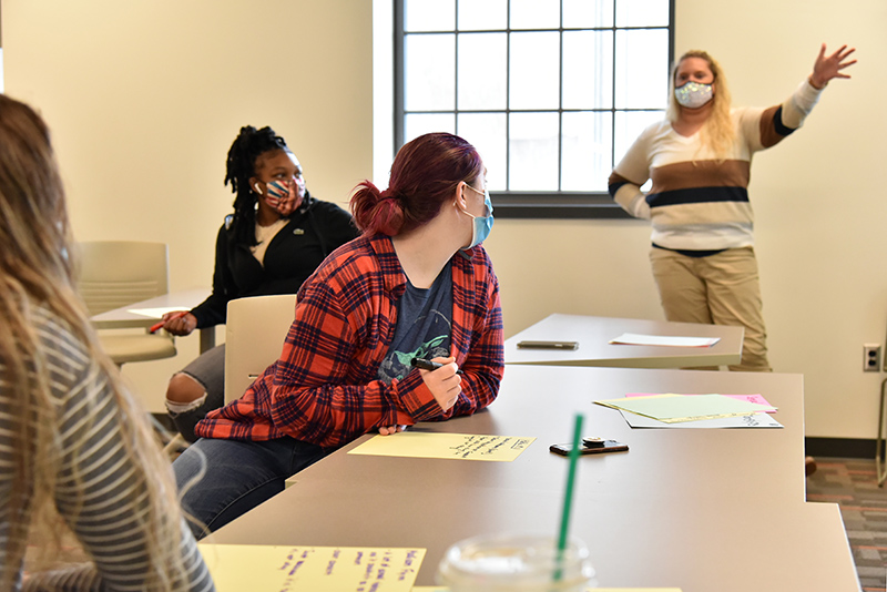 Students participate in discussions during a “Sexual Health in the Media” class in Park Hall by Jessica Harris (pictured at right) of the health promotion and wellness department.