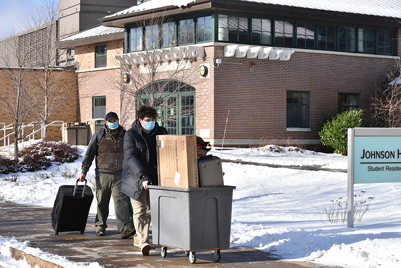 Cabot Wiggett, a freshman, moves into Johnson Hall with help from his dad Jan. 24, the first day of the week-long period scheduled for students to settle into their campus rooms.