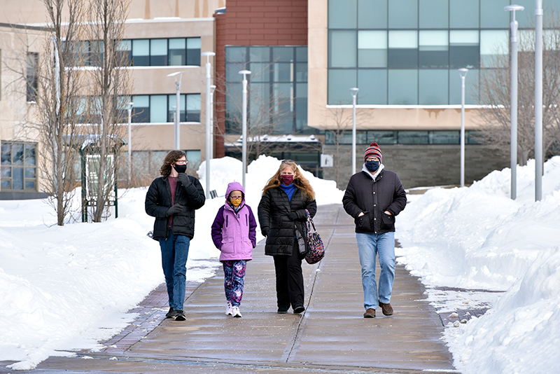 Prospective student Kyle Schnauffer (left), from Chittenango, checks out the campus with his parents and sister. 