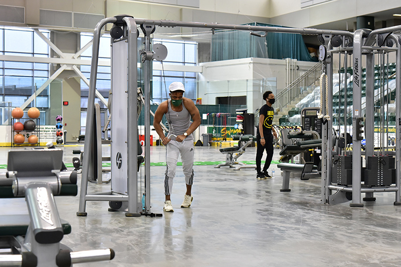 Tyreek Trapp, a junior finance major, works with exercise equipment in the Fitness Centers in Marano Campus Center arena during the Feb. 24 Wellness Day.