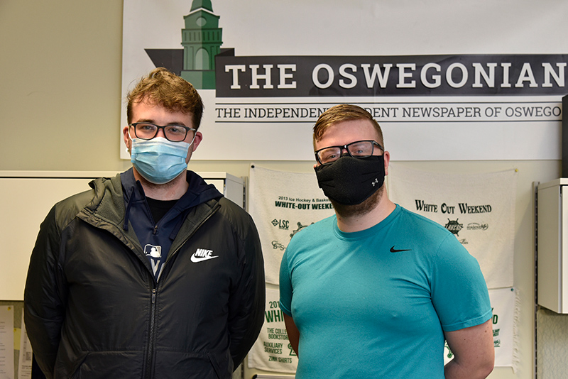 After a year that meant adapting news coverage to the realities of the pandemic, The Oswegonian is among the student organizations with a changing of the guard as the end of the semester nears. Incoming editor Brandon Ladd (left) receives a welcome from the outgoing editor, graduating senior Benjamin Grieco, who will continue his journalism career with local daily The Palladium-Times.