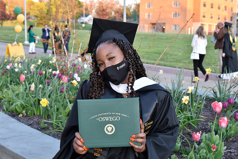 Kerisha Lewis earned her master's in strategic communication at the May 14 Commencement ceremony. Lewis earned her bachelor's from Oswego in 2018 and is now the college's assistant director of student-alumni engagement