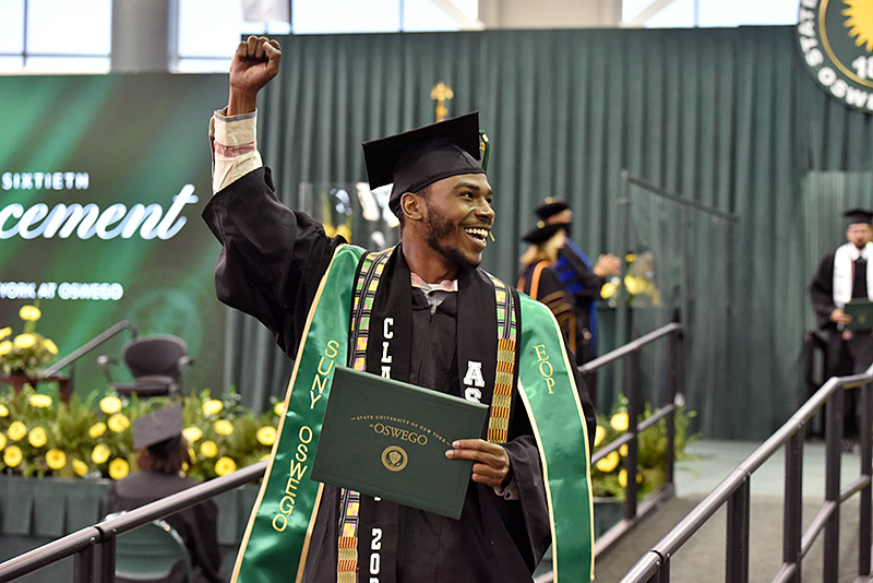 Benjamin Wall gives a jubilant cheer in receiving his diploma May 16 during the 3 p.m. commencement ceremony.