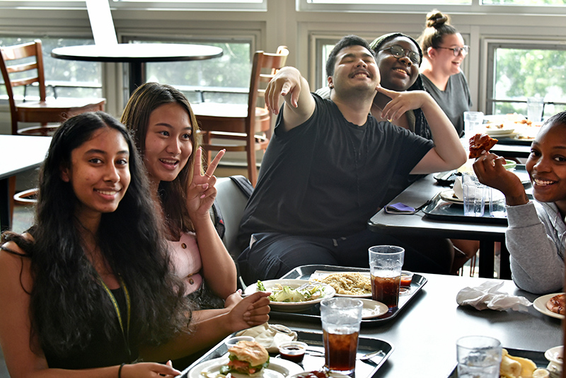 Educational Opportunity Program student leaders enjoy some dinner at Lakeside Dining Hall on June 30.