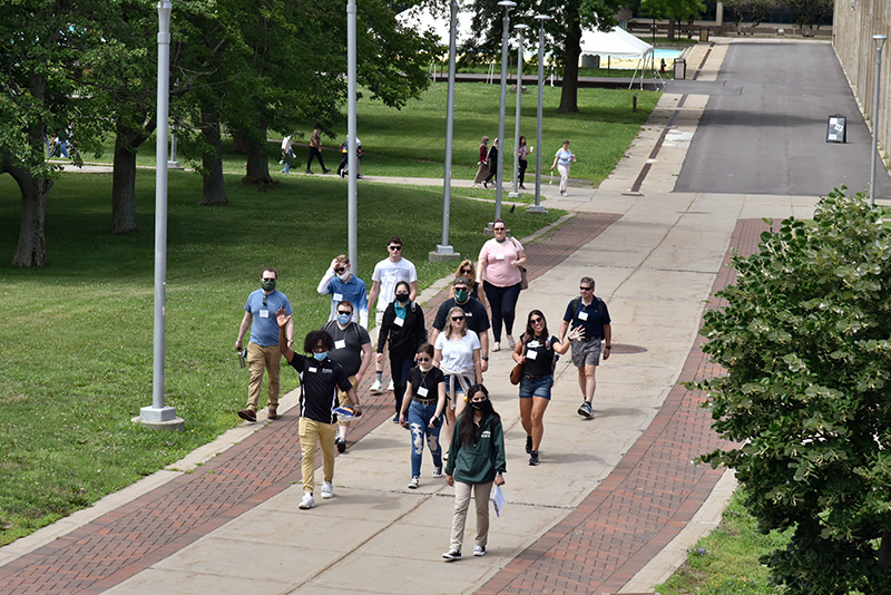 Laker Leaders in the Class of 2023 Mike Vodzogbe, a wellness management major, and Gia Sharma, an information science major, lead a group of parents toward Marano Campus Center on July 16 during New Student Orientation.